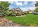Wide backyard with screened-in back porch, a deck, and a separate garage with lush landscaping at 4119 Alayna Lee Cir, Mcdonough, GA 30252