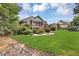 Backyard with beautiful lawn, mature landscaping, screened in porch and view of brick home at 4119 Alayna Lee Cir, Mcdonough, GA 30252