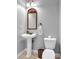 Stylish half bathroom featuring a pedestal sink, toilet, and attractive lighting at 4119 Alayna Lee Cir, Mcdonough, GA 30252