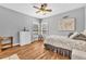 Bedroom featuring hardwood floors, neutral walls, and ample natural light at 4119 Alayna Lee Cir, Mcdonough, GA 30252
