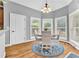 Charming breakfast nook bathed in natural light, featuring hardwood floors and a cozy dining set at 4119 Alayna Lee Cir, Mcdonough, GA 30252