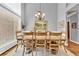 Formal dining room featuring a wood table, chairs, chandelier, and large windows with great natural light at 4119 Alayna Lee Cir, Mcdonough, GA 30252
