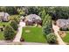 Stately brick home with professionally landscaped front yard, mature trees and elegant curb appeal at 4119 Alayna Lee Cir, Mcdonough, GA 30252