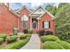 Beautiful brick home with manicured front yard, decorative fountain, and welcoming walkway at 4119 Alayna Lee Cir, Mcdonough, GA 30252