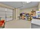 Garage with an automatic door and storage shelving, including an overflowing supply of Scott brand paper towels at 4119 Alayna Lee Cir, Mcdonough, GA 30252
