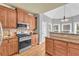Kitchen with wood cabinets, stainless steel appliances, granite countertops, and breakfast bar at 4119 Alayna Lee Cir, Mcdonough, GA 30252