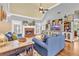 Comfortable living room featuring a fireplace, hardwood floors, and a plush blue sofa at 4119 Alayna Lee Cir, Mcdonough, GA 30252