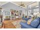Open living room featuring hardwood floors and an open-concept design leading to the dining area and kitchen at 4119 Alayna Lee Cir, Mcdonough, GA 30252