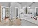 Bright bathroom featuring double vanity, large mirrors and ceramic tile floors at 4119 Alayna Lee Cir, Mcdonough, GA 30252