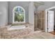 Beautiful bathroom featuring walk-in shower, and soaking tub at 4119 Alayna Lee Cir, Mcdonough, GA 30252