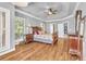 View of main bedroom with hardwood floors, ceiling fan, and walk-in closet at 4119 Alayna Lee Cir, Mcdonough, GA 30252