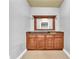 Elegant wet bar featuring granite countertop and wooden cabinets, ideal for entertaining at 4119 Alayna Lee Cir, Mcdonough, GA 30252
