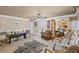 Wide view of finished basement featuring multiple seating areas, bar, and ample lighting at 6597 River Island Drive Dr, Buford, GA 30518