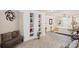 Spacious bedroom featuring built-in shelving and a comfortable seating area with decorative pillows at 6597 River Island Drive Dr, Buford, GA 30518