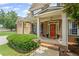 Inviting front porch with brick steps, decorative wreath, and charming curb appeal at 6597 River Island Drive Dr, Buford, GA 30518