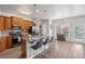 Open kitchen boasts stainless appliances, granite counters, and seating, creating an ideal entertaining space at 6597 River Island Drive Dr, Buford, GA 30518