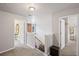 Upstairs landing with carpet and neutral paint. Doors to other rooms are visible at 6597 River Island Drive Dr, Buford, GA 30518