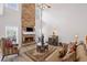 Two-story living room features a stone fireplace and lots of natural light at 6597 River Island Drive Dr, Buford, GA 30518