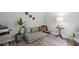 Cozy living room with stylish chaise lounge, plant, and accent table at 6597 River Island Drive Dr, Buford, GA 30518