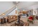 Cozy living room with open view to the gourmet kitchen and a staircase, creating a connected living space at 6597 River Island Drive Dr, Buford, GA 30518