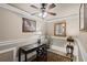 Charming office with detailed wainscoting, a decorative ceiling, and an elegant writing desk at 6597 River Island Drive Dr, Buford, GA 30518