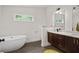 Modern bathroom features a soaking tub, dual vanity, and stylish fixtures at 1564 Belva Ave, Decatur, GA 30032