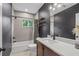 Well-lit bathroom features a sleek vanity, modern fixtures, and a shower-tub combo at 1564 Belva Ave, Decatur, GA 30032