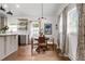 Eat-in kitchen with hardwood floors, three windows and a table with four chairs at 1564 Belva Ave, Decatur, GA 30032