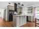 Contemporary kitchen with an island, stainless steel appliances, and hardwood floors at 1564 Belva Ave, Decatur, GA 30032