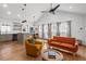 Open concept living room and kitchen with modern finishes, hardwood floors, and stylish furniture at 1564 Belva Ave, Decatur, GA 30032