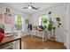 Bright home office boasts hardwood flooring, white walls, and natural light from multiple windows at 1564 Belva Ave, Decatur, GA 30032