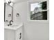 Bright bathroom features white vanity, black fixtures, and natural light at 336 Fond Du Lac Dr, Stone Mountain, GA 30088