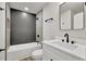 Bathroom featuring a tub/shower combo, toilet, and vanity with black fixtures at 336 Fond Du Lac Dr, Stone Mountain, GA 30088