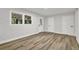 Bedroom with natural light, features wood-look floors and white doors at 336 Fond Du Lac Dr, Stone Mountain, GA 30088