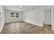 Bedroom with wood floors, white walls, and bright natural light at 336 Fond Du Lac Dr, Stone Mountain, GA 30088