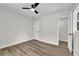 Bedroom with a ceiling fan, fresh paint, and two entry ways at 336 Fond Du Lac Dr, Stone Mountain, GA 30088
