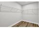 Walk-in closet space with wire shelving and wood-look flooring at 336 Fond Du Lac Dr, Stone Mountain, GA 30088
