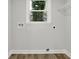 Spacious laundry room with wood-look floors and connections for appliances at 336 Fond Du Lac Dr, Stone Mountain, GA 30088