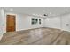 Spacious living room featuring hardwood flooring, recessed lighting and a sleek wooden front door at 336 Fond Du Lac Dr, Stone Mountain, GA 30088