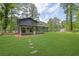 Charming home featuring a sunroom extension and a spacious, manicured lawn, perfect for outdoor enjoyment at 336 Fond Du Lac Dr, Stone Mountain, GA 30088