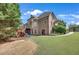 Expansive backyard featuring a playset and well-maintained lawn, ideal for Gathering activities at 3451 Falls Branch Ct, Buford, GA 30519
