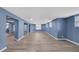Spacious basement featuring blue walls and wood-look flooring at 3451 Falls Branch Ct, Buford, GA 30519