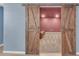 Basement with open wooden barn doors and recessed lighting at 3451 Falls Branch Ct, Buford, GA 30519
