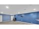 Finished basement with wood flooring and a mounted television at 3451 Falls Branch Ct, Buford, GA 30519