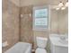 Cozy bathroom featuring a bathtub, tiled walls, and a vanity with storage at 3451 Falls Branch Ct, Buford, GA 30519