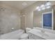 Bathroom with a tub, shower, toilet, and single sink vanity at 3451 Falls Branch Ct, Buford, GA 30519