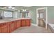 Bathroom featuring double sinks, tile flooring, and stained glass window at 3451 Falls Branch Ct, Buford, GA 30519