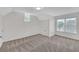 Bright bedroom boasts patterned carpet and large windows letting in natural light at 3451 Falls Branch Ct, Buford, GA 30519