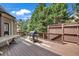 Wooden deck with a built-in grill, perfect for outdoor cooking and entertaining guests at 3451 Falls Branch Ct, Buford, GA 30519