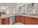Spacious kitchen area showcasing granite counters, stainless steel dishwasher, and modern fixtures at 3451 Falls Branch Ct, Buford, GA 30519